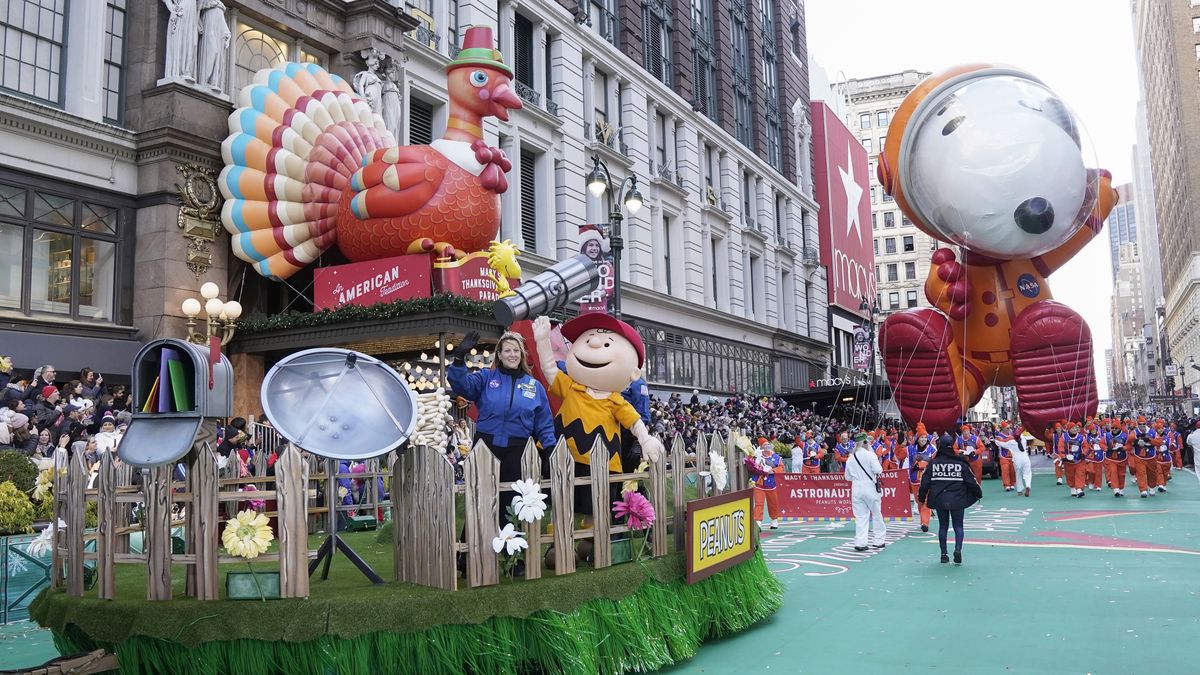 MACY'S THANKSGIVING DAY PARADE -- Pictured: (l-r) Astronaut Captain Kathryn (Kay) Hire on Snoopys Dog house float  from Peanuts Worldwide, Astronaut Snoopy ballon at the 93rd Macy's Thanksgiving Day Parade in New York City on Thursday November 28, 2019 -- (Photo by: Peter Kramer/NBC/NBCU Photo Bank via Getty Images)