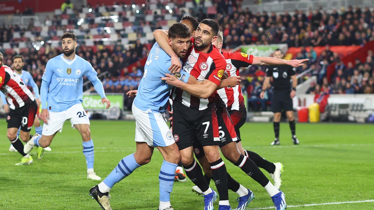 BRENTFORD, ENGLAND - FEBRUARY 5: Neal Maupay of Brentford holds Ruben Dias of Manchester City during the Premier League match between Brentford FC and Manchester City at Brentford Community Stadium on February 5, 2024 in Brentford, England. (Photo by Mark Leech/Offside/Offside via Getty Images)