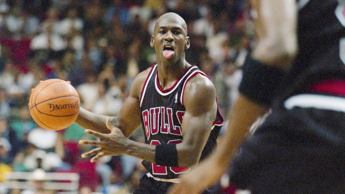 Michael Jordan #23, Shooting Guard and Small Forward for the Chicago Bulls in motion dribbling the basketball down court during the NBA Atlantic Division basketball game against the Orlando Magic on 14th November 1995 at the Orlando Arena, Orlando, Florida, United States. The Orlando Magic won the game 94 - 88. (Photo by Allsport/Getty Images)