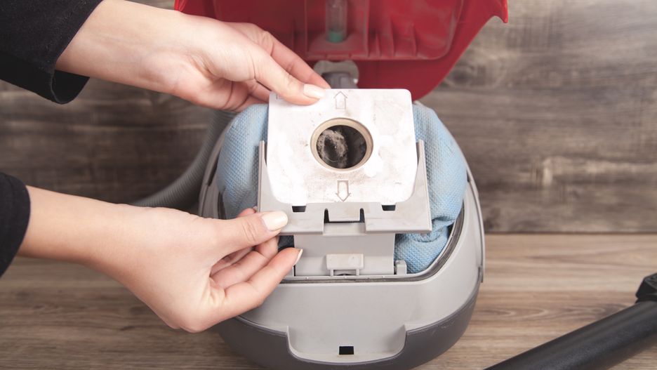 Girl showing dust bag in a vacuum cleaner.
home, clean, equipment, electric, cleaner, hand, housework, dust, floor, vacuum, modern, bag, sack, appliance, container, replacement, tidy, filter, opening, dirty, man, hygiene, white, house, wooden, service, machine, cleanup, room