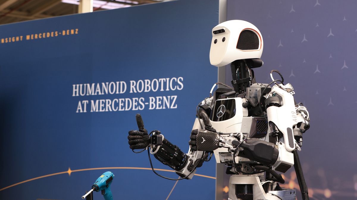 An Apollo humanoid robot prototype, made by Apptronik Inc., reacts during a media day at the Mercedes-Benz Digital Factory Campus in Berlin, Germany on Tuesday, March 18, 2025. Mercedes-Benz showcased its AI technologies and humanoid robots it plans to use to accelerate the transformation of its production network, according to a company press release. Photographer: Krisztian Bocsi/Bloomberg via Getty Images