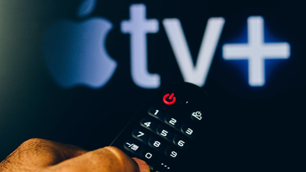 BRAZIL - 2022/02/21: In this photo illustration, a hand holding a TV remote control points to a screen that displays the  Apple TV+ (Plus) logo. (Photo Illustration by Rafael Henrique/SOPA Images/LightRocket via Getty Images)