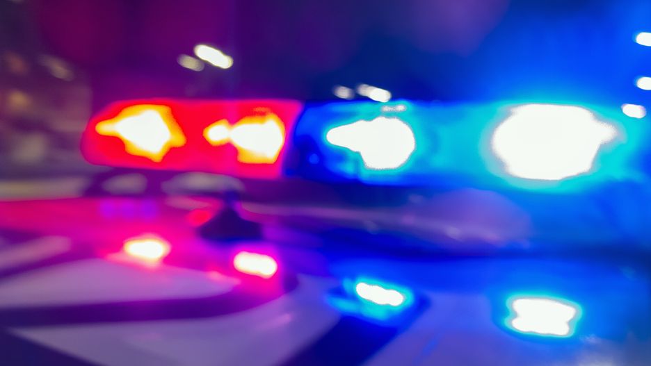 Police car lights in night time, crime scene, night patrolling the city. Abstract blurry image.Police car lights in night time, crime scene, night patrolling the city. Abstract blurry image.Evgen_Prozhyrko