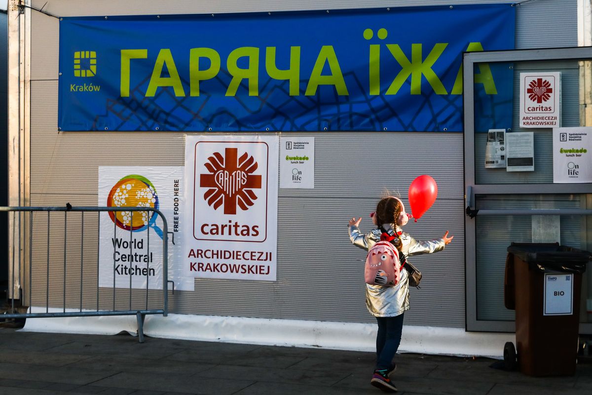 Humanitarian aid tent of Caritas foundation with food for refugees from Ukraine who arrived to Krakow due to ongoing Russian attacks on Ukraine is seen next to the main railway station in Krakow, Poland on March 28, 2022. Russian invasion on Ukraine causes a mass exodus of refugees to Poland.   (Photo by Beata Zawrzel/NurPhoto via Getty Images)