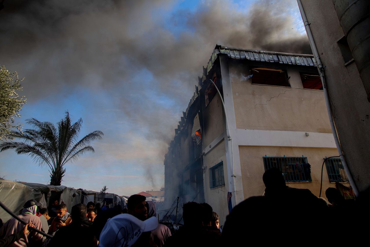KHAN YUNIS, GAZA - JANUARY 24: Smoke rises after Israeli attacks hit training center of the United Nations Relief and Works Agency for Palestinian Refugees in the Near East (UNRWA), where more than ten thousand civilians took shelter, in Khan Yunis, Gaza on January 24, 2024. The facility was providing shelter for more than ten thousand civilians. The attack resulted in a fire breaking out in one of the buildings within the center. (Photo by Ramez Habboub/Anadolu via Getty Images)
