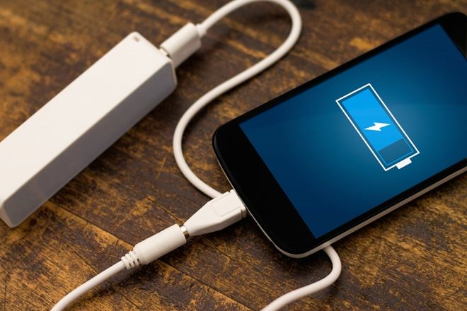 Phone charging with energy bank. Depth of field on Power bank 