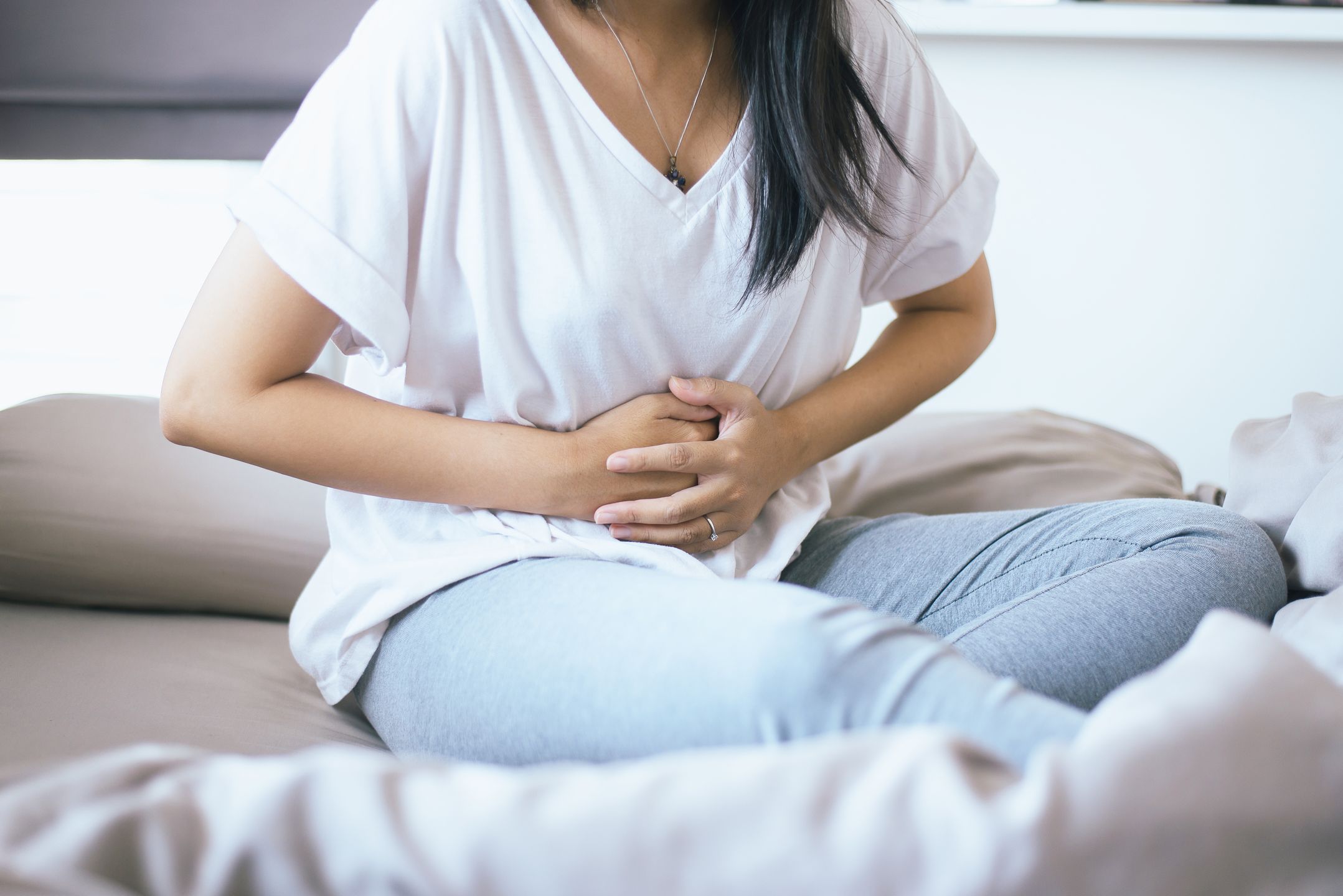 Woman having painful stomachache,Female suffering from abdominal pain 