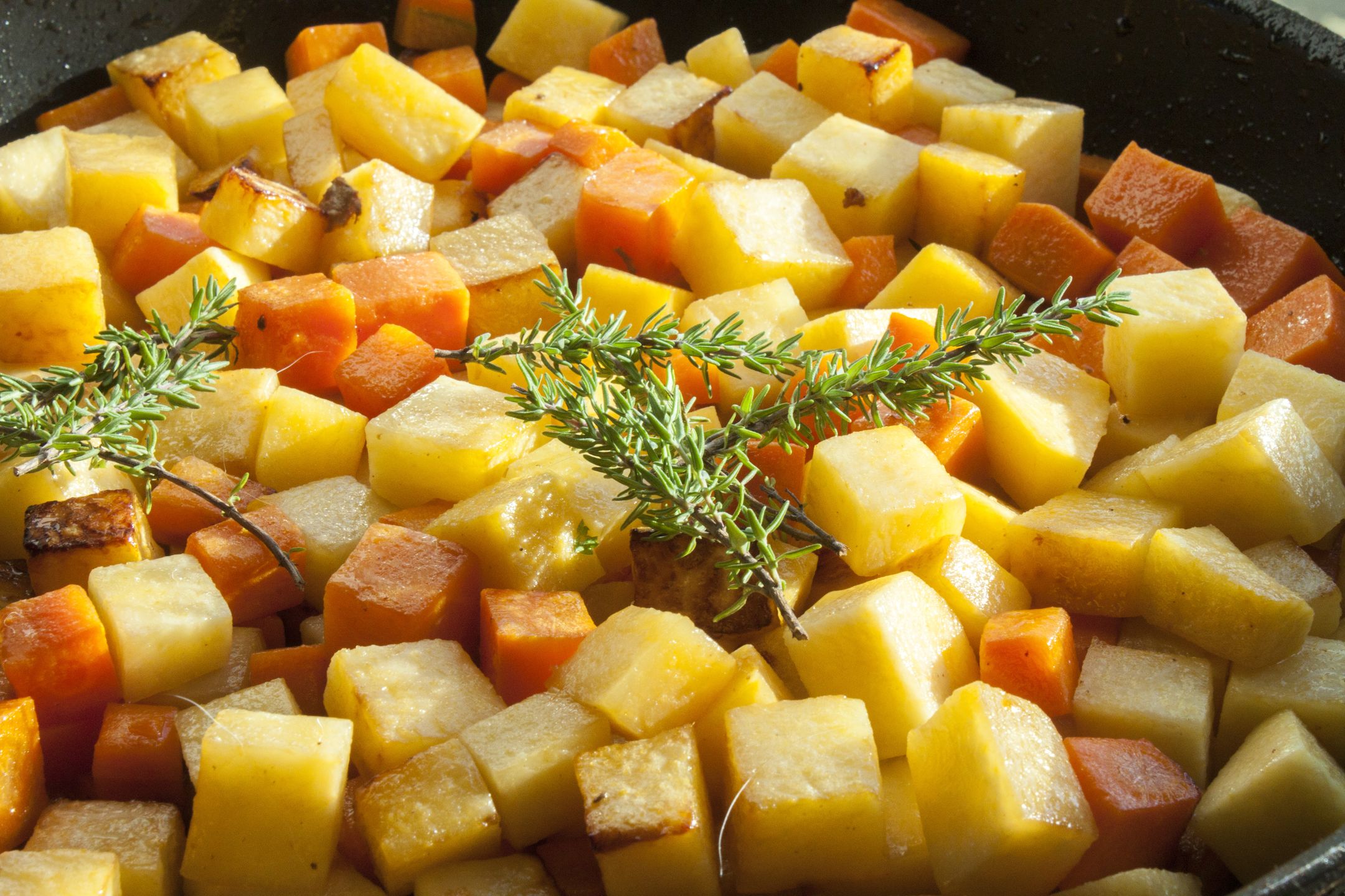 Green thyme on diced carrots and sweedes 