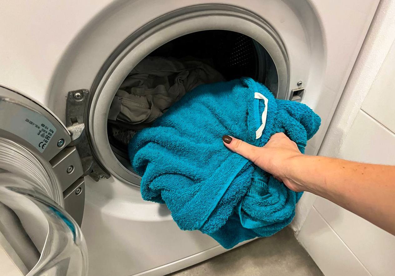 Put a dry towel in the washing machine. It will shorten the clothes drying time