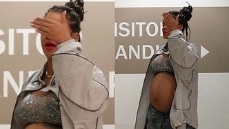 Rihanna zasłania się przed fotoreporterami na lotnisku w Los Angeles, eksponując olbrzymi, ciążowy brzuch (ZDJĘCIA)