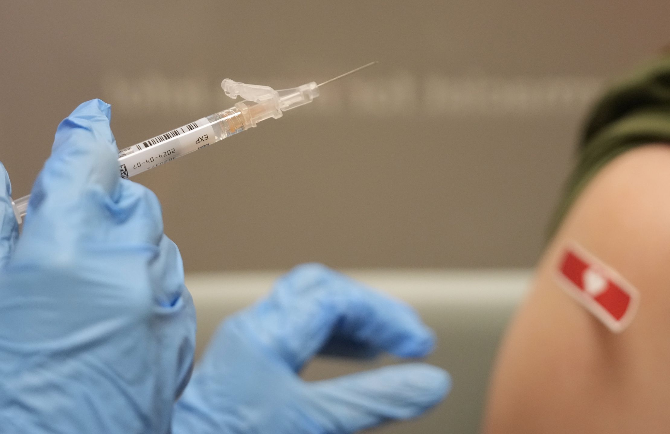 CYPRESS, TEXAS - SEPTEMBER 20: Kim Nguyen, pharmacist, prepares to give a Moderna Spikevax COVID-19 vaccine at CVS, 12550 Louetta Rd., Wednesday, Sept. 20, 2023, in Cypress. (Melissa Phillip/Houston Chronicle via Getty Images)