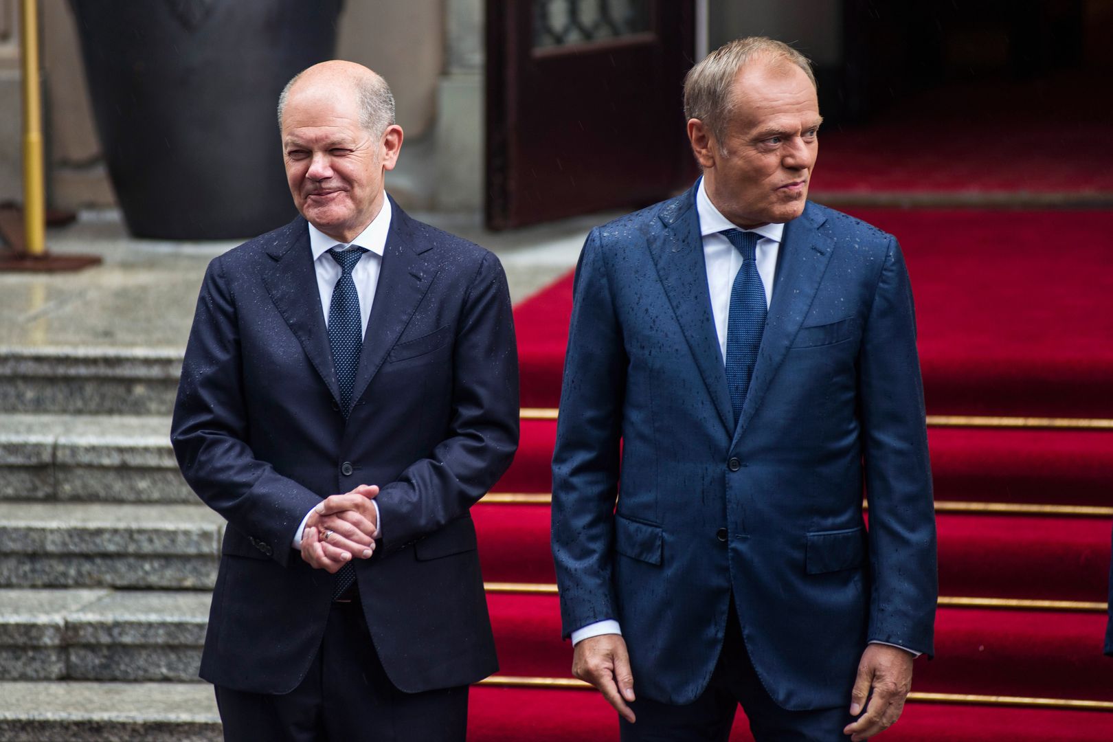 WARSAW, POLAND - 2024/07/02: Prime Minister Donald Tusk (R) welcomes the German Chancellor Olaf Scholz (L) in the PM's Chancellery on Ujazdowskie Avenue in Warsaw. Polish-German intergovernmental consultations were held at the Chancellery of the Prime Minister in Warsaw under the chairmanship of Prime Minister Donald Tusk and Chancellor of the Federal Republic of Germany Olaf Scholz. Prime Minister Tusk and Chancellor Scholz, together with their ministers, talked about the security of NATO's eastern flank in the context of the war in Ukraine, the threats related to illegal migration, as well as economic cooperation between the two countries. (Photo by Attila Husejnow/SOPA Images/LightRocket via Getty Images)