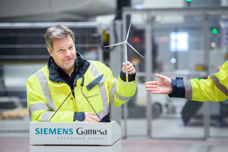 CUXHAVEN, GERMANY - JANUARY 31: German Federal Economy and Climate Action Minister Robert Habeck (l-r) gets a model wind turbine from Chief Executive Officer of Siemens Gamesa Renewable Energy Jochen Eickholt during a press conference while visiting the Siemens Gamesa wind turbine factory on January 31, 2023 in Cuxhaven, Germany. Siemens Gamesa specialises in wind turbines for offshore wind parks. (Photo by Gregor Fischer/Getty Images)