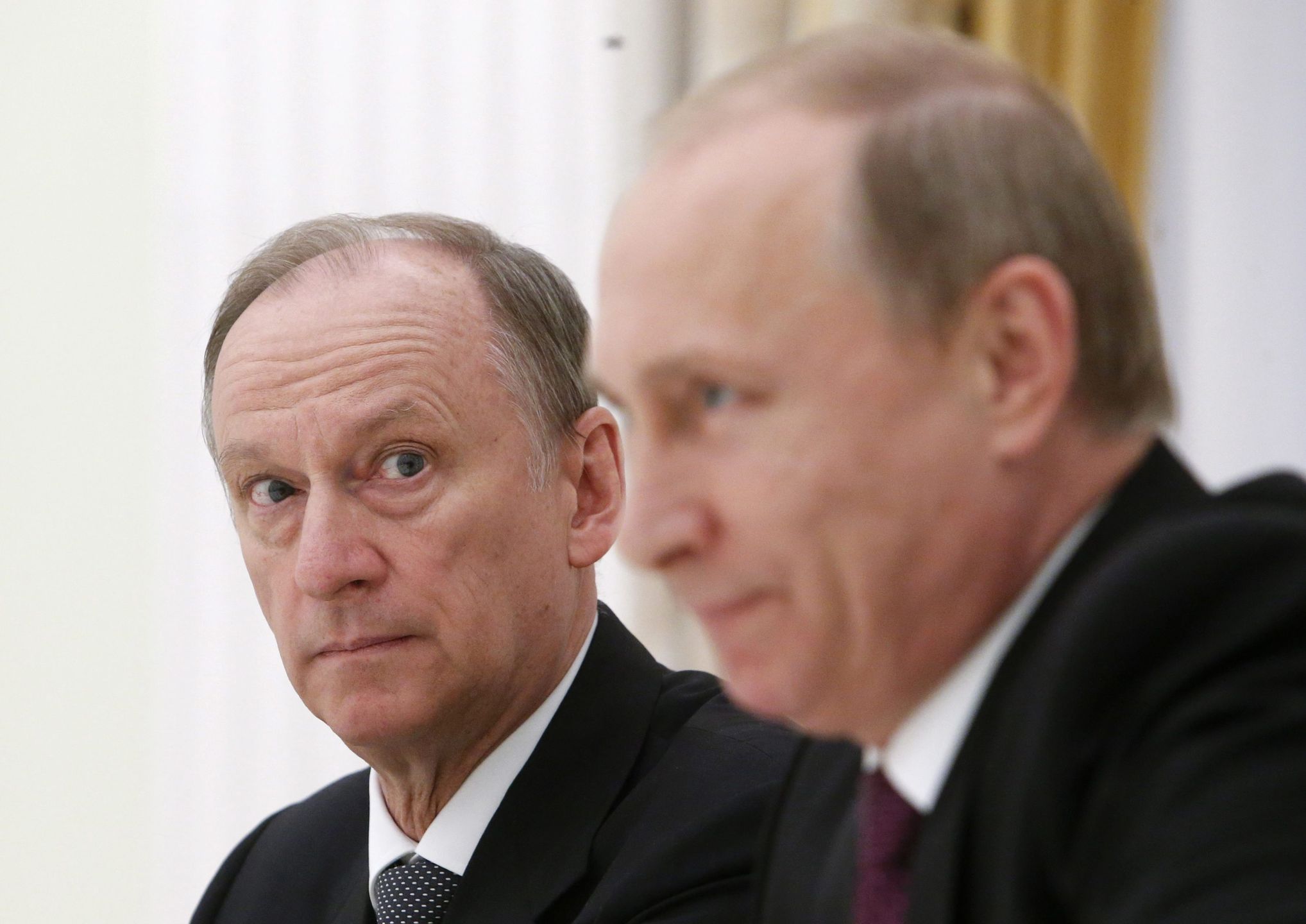 Putin attends a meeting with the BRICS countries' senior officials in Moscowepa04768637 Russian Security Council Secretary Nikolai Patrushev (L) looks at President Vladimir Putin during a meeting with the BRICS countries' senior officials in charge of security matters at the Kremlin in Moscow, Russia, 26 May 2015.  EPA/SERGEI KARPUKHIN / POOL Dostawca: PAP/EPA.SERGEI KARPUKHIN / POOL