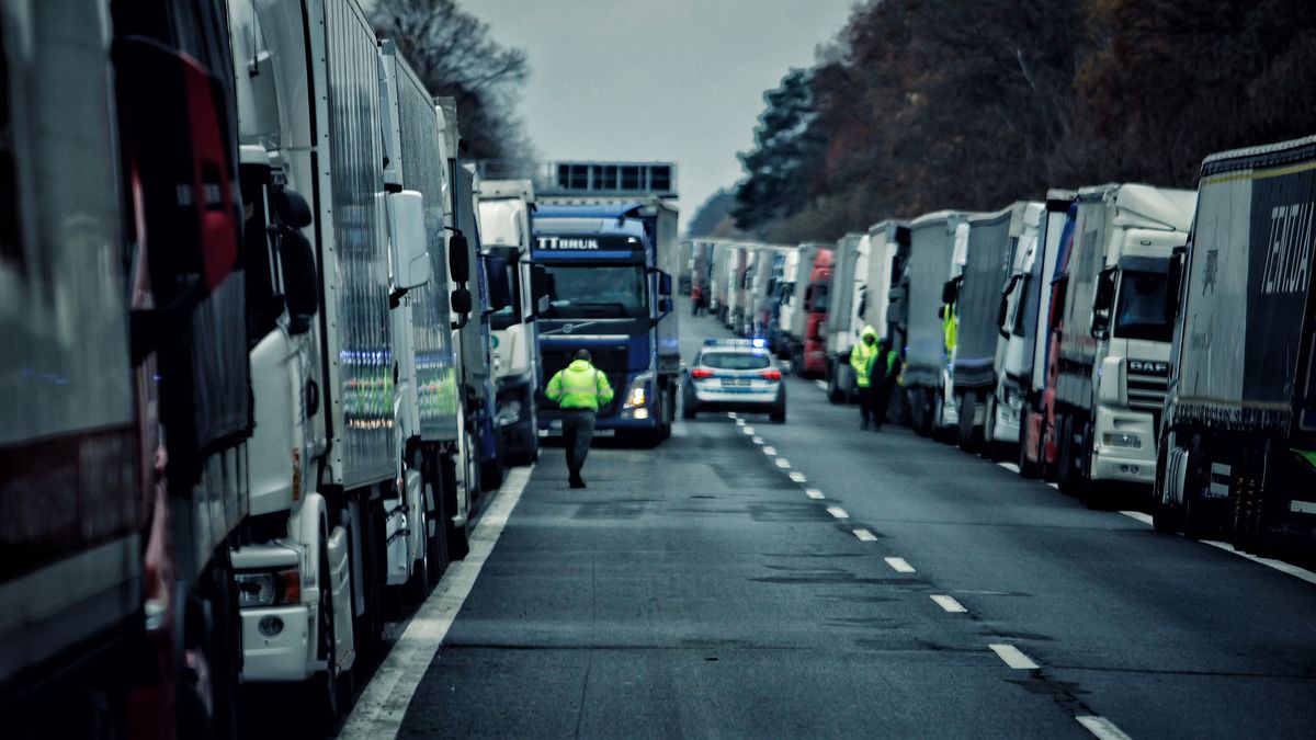 LUBLIN VOIVODESHIP, POLAND - NOVEMBER 19: Ukrainian drivers wait near their trucks, blocked by Polish protesters near the Polish Ukrainian border crossing on November 19, 2023 in Lublin Voivodeship, Poland. Polish truck drivers continue to block the main Polish-Ukrainian border crossing points for freight traffic - Hrebenne, Dorohusk and Korczowa. The key demand of Polish protesters is to bring back the system of issuing permits for Ukrainian carriers to work in the EU. Due to the strike, about 2,900 Ukrainian trucks, including trucks with humanitarian aid and fuel tanker trucks, are waiting at the border with Ukraine as of November 19. (Photo by Yan Dobronosov/Global Images Ukraine via Getty Images)