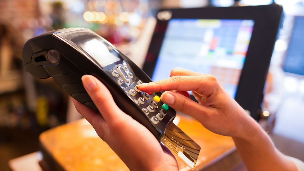 Female payment  close-up shop electronic reader plastique cardLaurent Delhourmebank, banking, business, buy, card, cards, cashier, caucasian, checkout, client, computer, concept, consumerism, credit, customer, debit, device, electronic, female, finance, financial, fraud, hand, holding, isolated, lifestyle, machine, market, modern, money, number, pay, paying, payment, people, person, plastic, purchase, restaurant, retail, sale, security, selling, shop, shopper, shopping, store, terminal, transaction, woman
