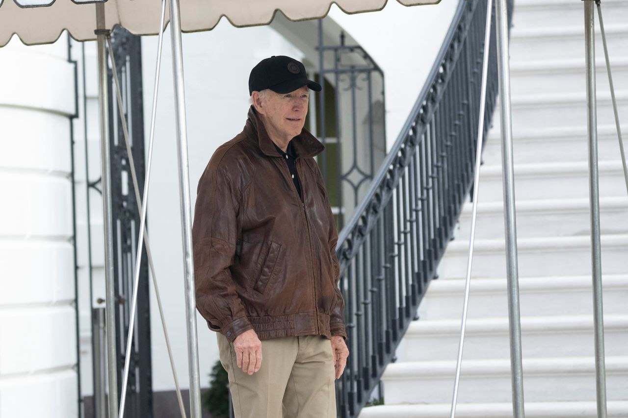 US President Joe Biden walks over to speak to members of the media on the South Lawn of the White House before boarding Marine One in Washington, DC, US, on Saturday, Jan. 13, 2024. The White House on Friday notified several agencies to prepare for a possible government shutdown with House Republicans divided in Congress over a spending deal. Photographer: Chris Kleponis/CNP/Bloomberg via Getty Images