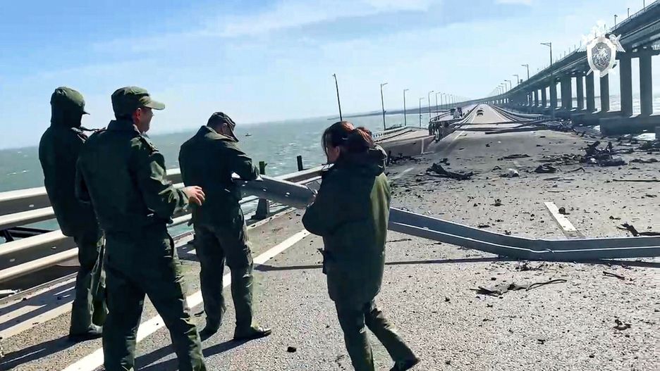 Zniszczony Most Krymski
In this image taken from video released by the Russian Investigative Committee, employees of the Russian Investigative Committee work at the scene of a damaged part of the Crimean Bridge connecting Russian mainland and Crimean peninsula over the Kerch Strait, near Kerch, Crimea, Saturday, Oct. 8, 2022. Russian authorities say a truck bomb has caused a fire and the collapse of a section of a bridge linking Russia-annexed Crimea with Russia. The bridge is a key supply artery for Moscow's faltering war effort in southern Ukraine.(Russian Investigative Committee via AP)