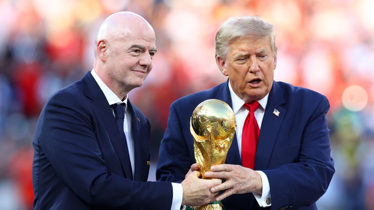 EAST RUTHERFORD, NEW JERSEY - JULY 19: FIFA President Gianni Infantino (L) holds the FIFA World Cup trophy alongside USA President Donald Trump at full-time following the FIFA World Cup 2026 Final match between Spain and Argentina at New York New Jersey Stadium on July 19, 2026 in East Rutherford, New Jersey. (Photo by Chris Brunskill/Fantasista/Getty Images)