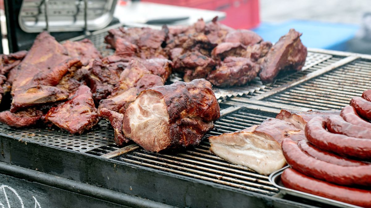 Juicy Grilled Meat Chunks And Sausages Cooking on Metal Grill. Various Cuts Beef And Pork Barbecue. Outdoor Cooking Summer Picnic Concept. (Photo by: Natasha Breen/REDA/Universal Images Group via Getty Images)