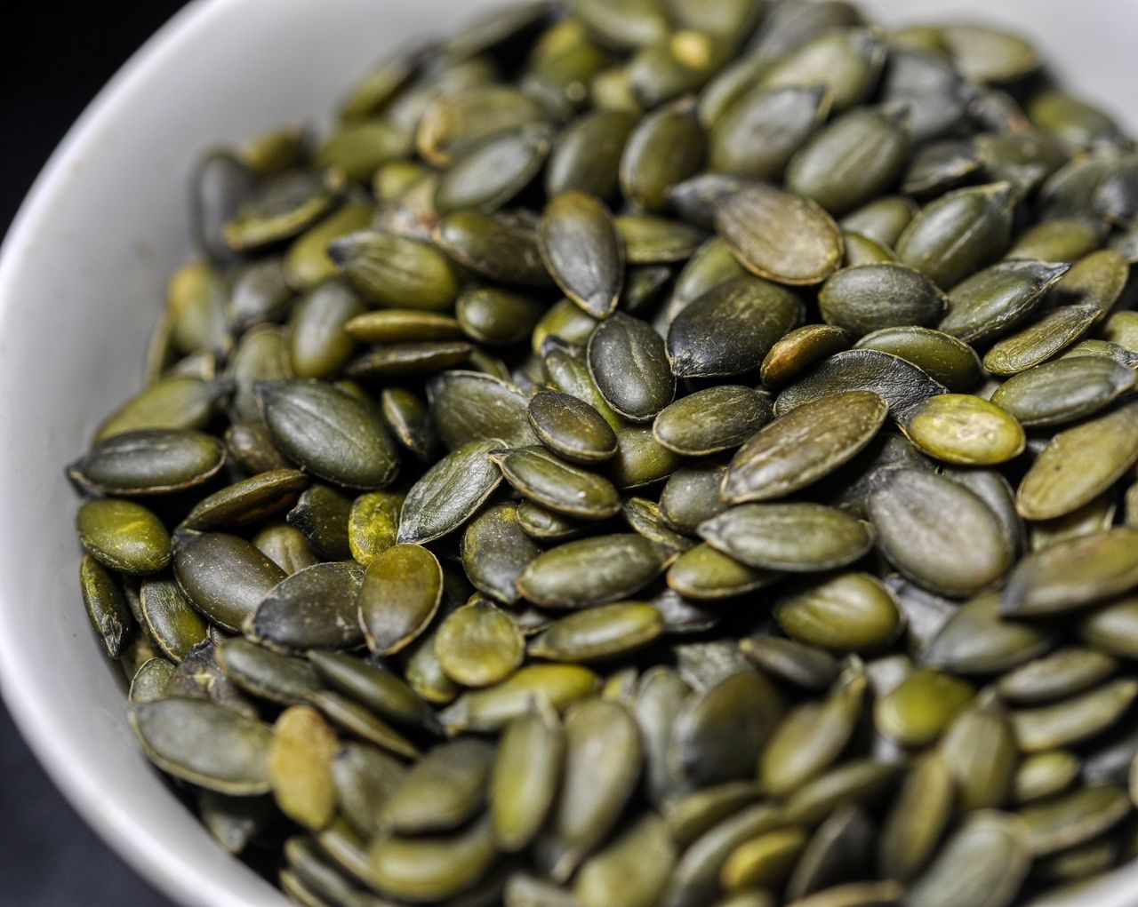 pumpkin seeds
close up photo of some pumpkin seeds
Frank Brennan