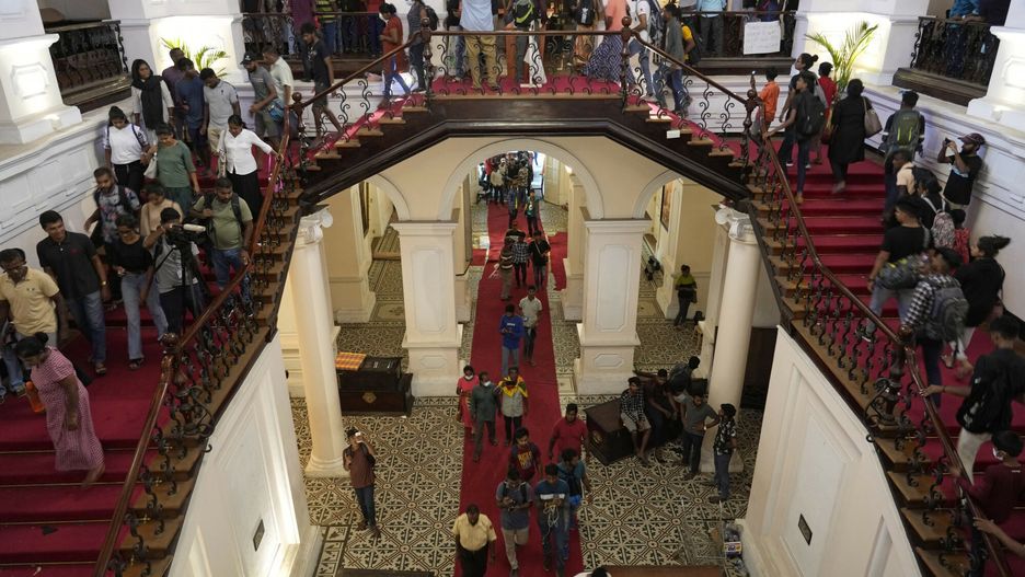 Temporary
People arrives at the official residence of president Gotabaya Rajapaksa fourth days after it was stormed by anti government protesters in Colombo in Colombo, Sri Lanka, Wednesday, July 13, 2022. The president of Sri Lanka fled the country early Wednesday, days after protesters stormed his home and office and the official residence of his prime minister amid a monthslong economic crisis that triggered severe shortages of food and fuel.(AP Photo/Rafiq Maqbool)
AP
