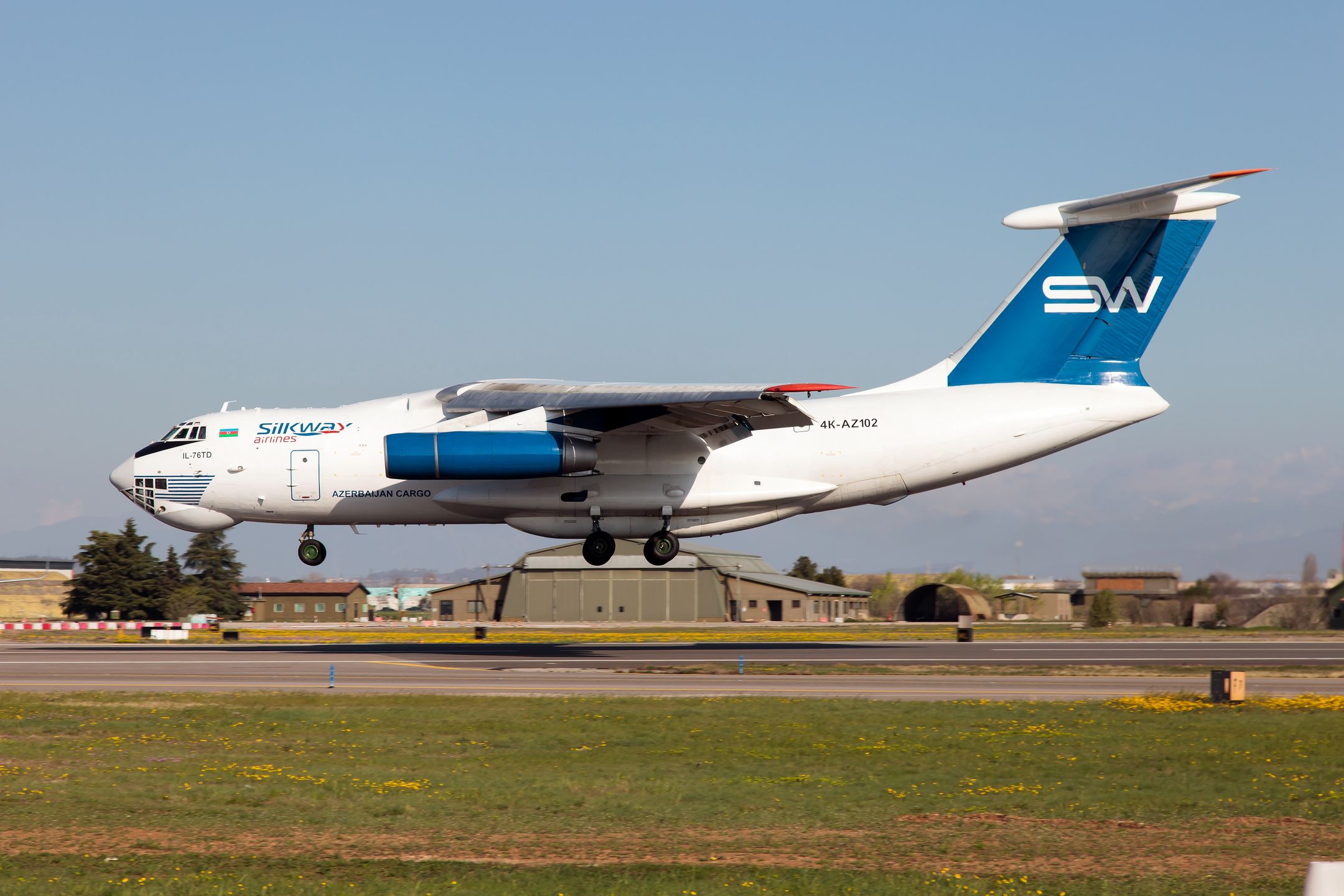VERONA VILLAFRANCA AIRPORT, VERONA, ITALY - 2023/03/25: A Silk Way Airlines Ilyushin IL-76TD landing at Verona Villafranca airport.Silk Way Airlines is an Azerbaijani private cargo airline based in Baku. It operates freight services to Asia, the Middle East, and Europe, as well as services for government organizations. The Ilyushin Il-76 is a strategic airlifter designed by the Soviet Union's Ilyushin design bureau. It was first planned as a commercial freighter in 1967, as a replacement for the Antonov An-12. It was designed to deliver heavy machinery to remote, poorly served areas. (Photo by Fabrizio Gandolfo/SOPA Images/LightRocket via Getty Images)