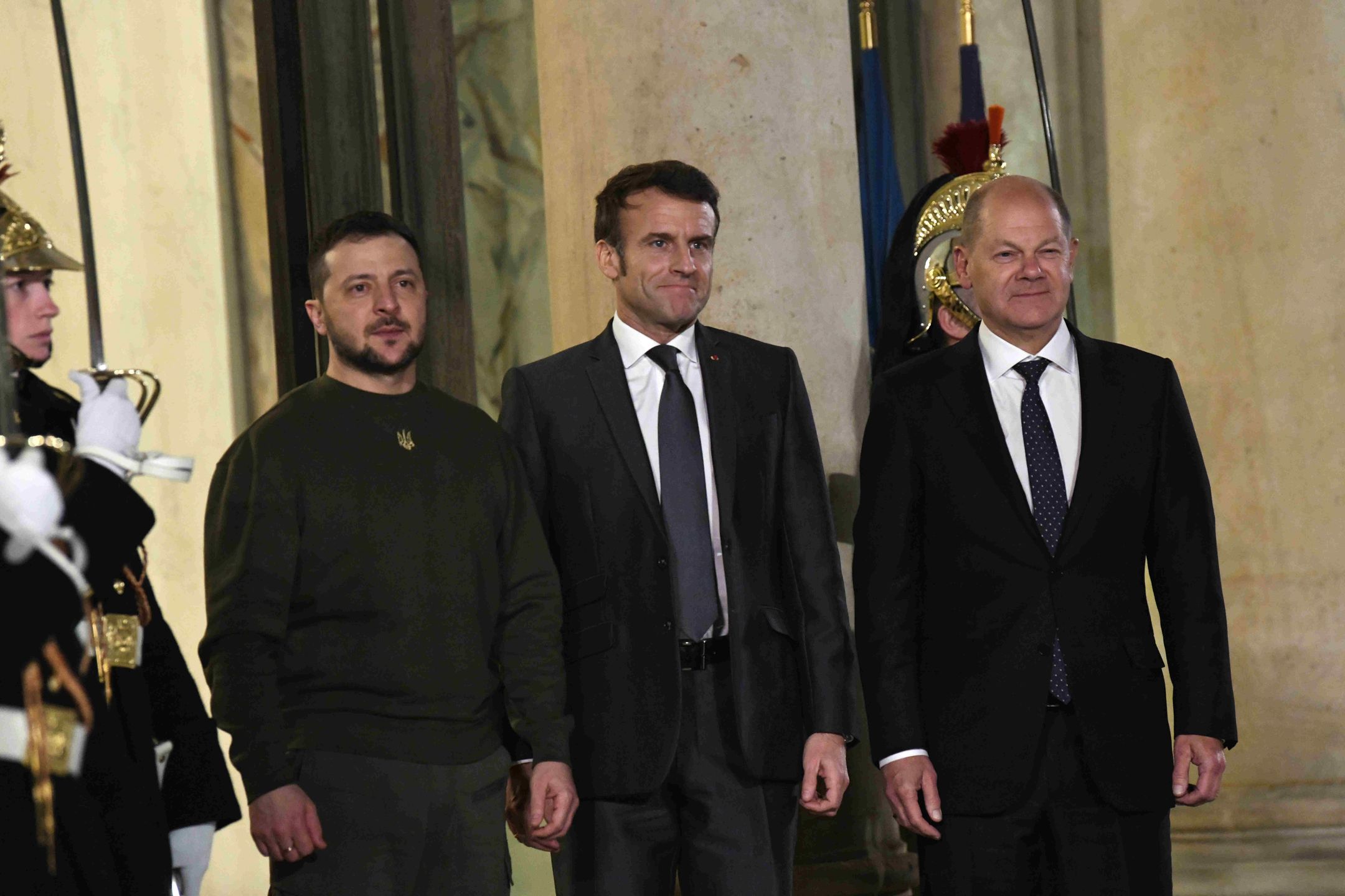 PARIS, FRANCE - FEBRUARY 08: Ukrainian President Volodymyr Zelensky (L) is welcomed by French President Emmanuel Macron (C) and German Chancellor Olaf Scholz upon his arrival at the Elysee Palace on February 8, 2023 in Paris, France. (Photo by Li Yang/China News Service/VCG via Getty Images)