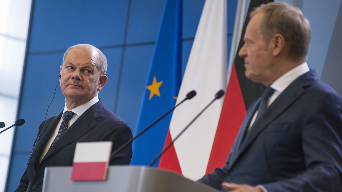 WARSAW, MASOVIAN VOIVODESHIP, POLAND - 2024/07/02: German Chancellor Olaf Scholz (L) and PM Donald Tusk (R) speak at a press conference in Warsaw. Polish-German intergovernmental consultations were held at the Chancellery of the Prime Minister in Warsaw under the chairmanship of Prime Minister Donald Tusk and Chancellor of the Federal Republic of Germany Olaf Scholz. Prime Minister Tusk and Chancellor Scholz, together with their ministers, talked about the security of the North Atlantic Treaty Organizations (NATO) eastern flank in the context of the war in Ukraine, the threats related to illegal migration, as well as economic cooperation between the two countries and about the World War 2 reparations. (Photo by Attila Husejnow/SOPA Images/LightRocket via Getty Images)