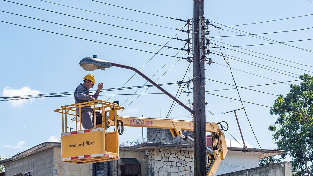 Electrician using a bucket truck to get high up to the top
CUBA - 2016/02/10: Electrician using a bucket truck to get high up to the top of light post, changes within the Cuban government have compelled them to make a better effort in maintaining the cities. (Photo by Roberto Machado Noa/LightRocket via Getty Images)
Roberto Machado Noa
electrician, bucket truck, light post, government, Cuban, bucket, truck, pole, worker, energy, repair, utility, electricity, service, work, voltage, electrical, cable, dangerous, danger, safety, wires, job, high, industrial, construction, tools, harness, helmet, transformer, men, vehicle, transportation, occupation, heights, hardhat, electric, person, shock