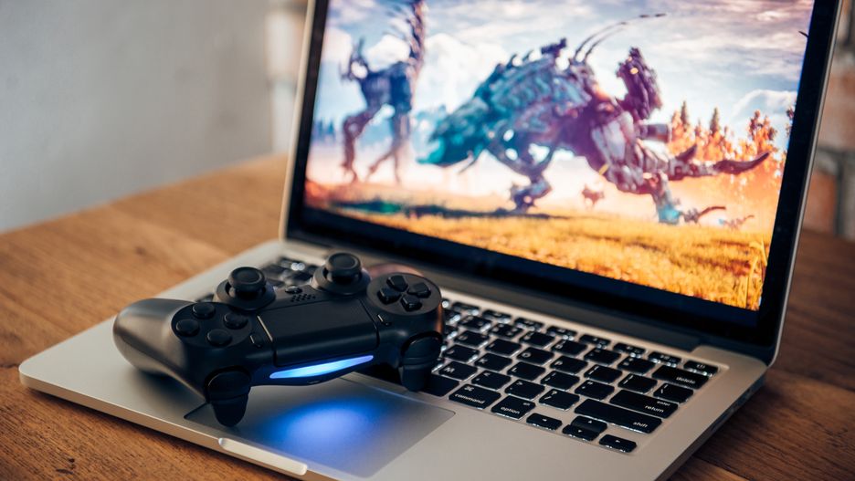 Video game controller on the laptop.Nuttapon Thathawongactivity, background, boy, button, computer, console, control, controller, device, electronic, entertainment, fun, game, gamer, games, gaming, hand, hobby, isolated, joy, joypad, joystick, laptop, leisure, pad, play, playing, remote, station, technology, video, white, young, activity, background, boy, button, computer, console, control, controller, device, electronic, entertainment, fun, game, gamer, games, gaming, hand, hobby, isolated, joy, joypad, joystick, laptop, leisure, pad, play, playing, remote, station, technology, video, white, young