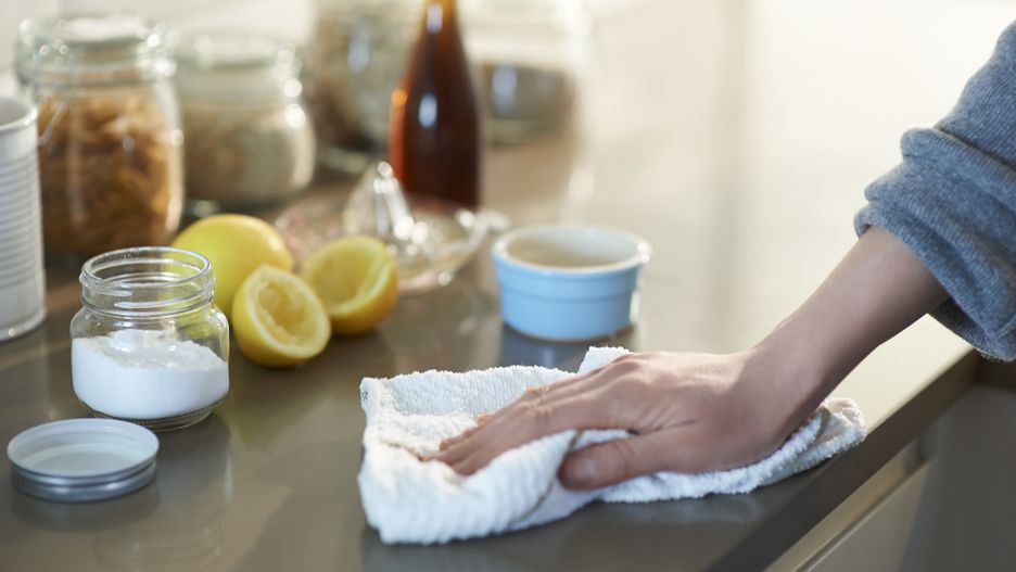 Cleaning kitchen with natural cleaning products.
Woman cleaning a kitchen worktop with natural cleaning products lemon, bicarbonate of soda and vinegar.
Dougal Waters