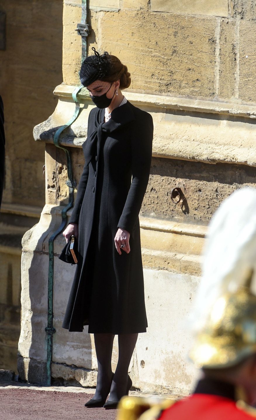 The Funeral Of Prince Philip, Duke Of Edinburgh Is Held In WindsorWINDSOR, ENGLAND - APRIL 17: Catherine, Duchess of Cambridge bows her head as she stands at the Galilee Porch of St George's Chapel during the funeral of Prince Philip, Duke of Edinburgh, at Windsor Castle on April 17, 2021 in Windsor, England. Prince Philip of Greece and Denmark was born 10 June 1921, in Greece. He served in the British Royal Navy and fought in WWII. He married the then Princess Elizabeth on 20 November 1947 and was created Duke of Edinburgh, Earl of Merioneth, and Baron Greenwich by King VI. He served as Prince Consort to Queen Elizabeth II until his death on April 9 2021, months short of his 100th birthday. His funeral takes place today at Windsor Castle with only 30 guests invited due to Coronavirus pandemic restrictions. (Photo by Steve Parsons - WPA Pool/Getty Images)WPA Pool