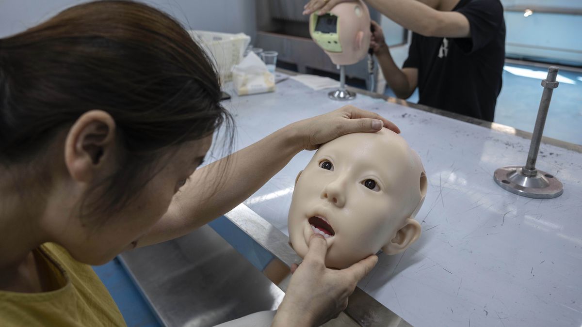 ZHONGSHAN, CHINA - JUNE 25: Staff members work with the robotic heads for silicone sex dolls, also known as love dolls, in the research and development area at a factory for WM Dolls on June 25, 2025 in Zhongshan, China. Advances in artificial intelligence and robotics are transforming the love doll industry in China, with WM Dolls, one of the biggest manufacturers, predicting a double-digit rise in sales this year. The company's next-generation companions feature silicone skin and realistic characteristics and are enhanced by open-source generative AI models that allow the fully customizable dolls to show personality traits, hold conversations, and mimic emotions. Most of the anthropomorphic products made by WM Dolls are for export with high-end models costing around $3000.  (Photo by Kevin Frayer/Getty Images)