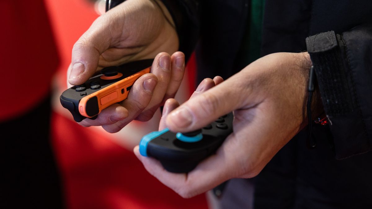 MILAN, ITALY - NOVEMBER 28: A gamers uses the Joy-Con 2 game controller for Nintendo Switch 2 as he plays video games at the Japanese publisher Nintendo Switch's stand during Milan Games Week & Cartoomics 2025 at Fiera Milano Rho on November 28, 2025 in Milan, Italy. Milan Games Week is the most important video games festival in Italy, featuring the latest news of gaming industry, the most exciting esports tournaments and amazing digital entertainment moments. (Photo by Emanuele Cremaschi/Getty Images)
