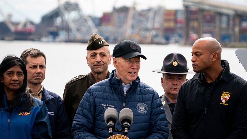 US President Joe Biden, center, speaks at the Maryland Transportation Authority Police headquarters in Dundalk, Maryland, US, on Friday, April 5, 2024. The Port of Baltimore may reopen for normal operations by the end of May after a limited-access channel is cleared for some ship traffic late this month, the US Army Corps of Engineers said. Photographer: Al Drago/Bloomberg via Getty Images
