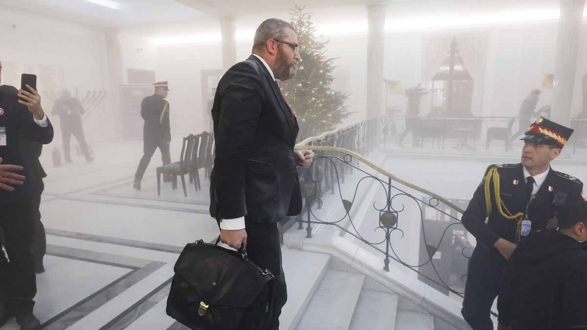 Grzegorz Braun, a far-right Polish lawmaker, is using a fire extinguisher on Hanukkah candles in parliament in Warsaw, Poland, on December 12, 2023. (Photo by Andrzej Iwanczuk/NurPhoto via Getty Images)