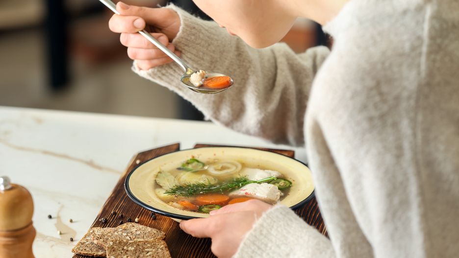 Woman eating tasty soup at tablebackground, board, boiled, bowl, broth, caucasian, closeup, cook, culinary, delicious, diet, dish, eating, female, fish, food, gastronomy, hands, healthy, hot, ingredient, kitchen, light, meal, natural, nutrition, people, person, preparing, recipe, soup, spoon, table, tasty, ukha, vegetables, woman, wooden, background, board, boiled, bowl, broth, caucasian, closeup, cook, culinary, delicious, diet, dish, eating, female, fish, food, gastronomy, hands, healthy, hot, ingredient, kitchen, light, meal, natural, nutrition, people, person, preparing, recipe, soup, spoon, table, tasty, ukha, vegetables, woman, wooden