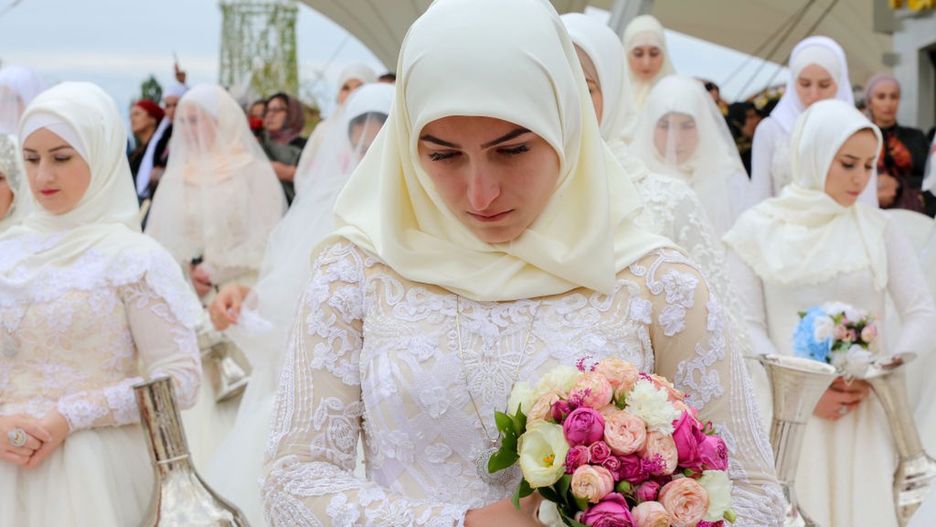 GROZNY, CHECHNYA, RUSSIA - OCTOBER 5, 2018: Brides seen as 200 wedding ceremonies are held in Tsvetochny Park [Flower Park] to mark the 200th birthday of the city of Grozny. Yelena Afonina/TASS (Photo by Yelena Afonina\TASS via Getty Images)