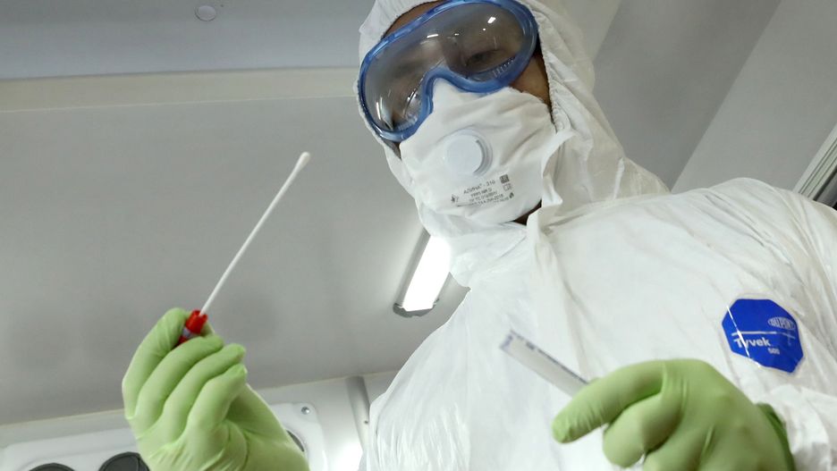 MOSCOW, RUSSIA - MARCH 6, 2020: An ambulance crew member in a Dupont Tyvek protective suit and a face mask inside an ambulance van. Moscow ambulance crews have been equipped to deal with cases of the novel coronavirus (COVID-19) and scan people's temperatures. As of March 6, 2020, Russia has confirmed four cases of the novel coronavirus, with one confirmed case in Moscow. In the world, more than 100,000 people have been infected with the COVID-19 virus in the world, with more than 80,000 in the People's Republic of China and more than 6,000 in South Korea and more than 4,000 in Italy. Mikhail Tereshchenko/TASS (Photo by Mikhail Tereshchenko\TASS via Getty Images)