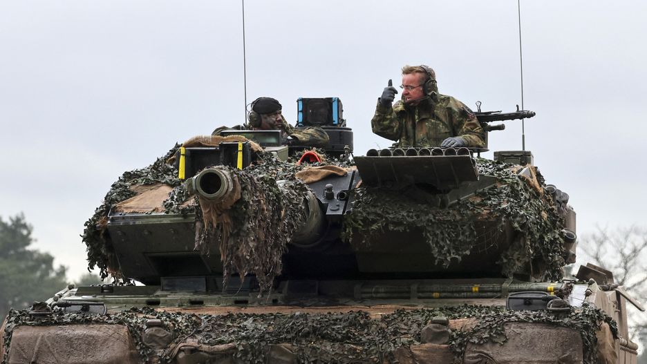 Boris Pistorius, Germany's defense minister, rides aboard a Leopard 2 A6 battle tank, destined for Ukraine, during a live fire presentation by the German Army Panzer Battalion 203 at the Field Marshal Rommel Barracks in Augustdorf, Germany, on Wednesday, Feb. 1, 2023. Germany pledged to supply Ukraine with 112 Leopard 2 battle tanks, regarded as one of the best tanks in the world, in a joint effort with allies to provide Ukraine's forces with a significant upgrade in firepower. Photographer: Alex Kraus/Bloomberg via Getty Images