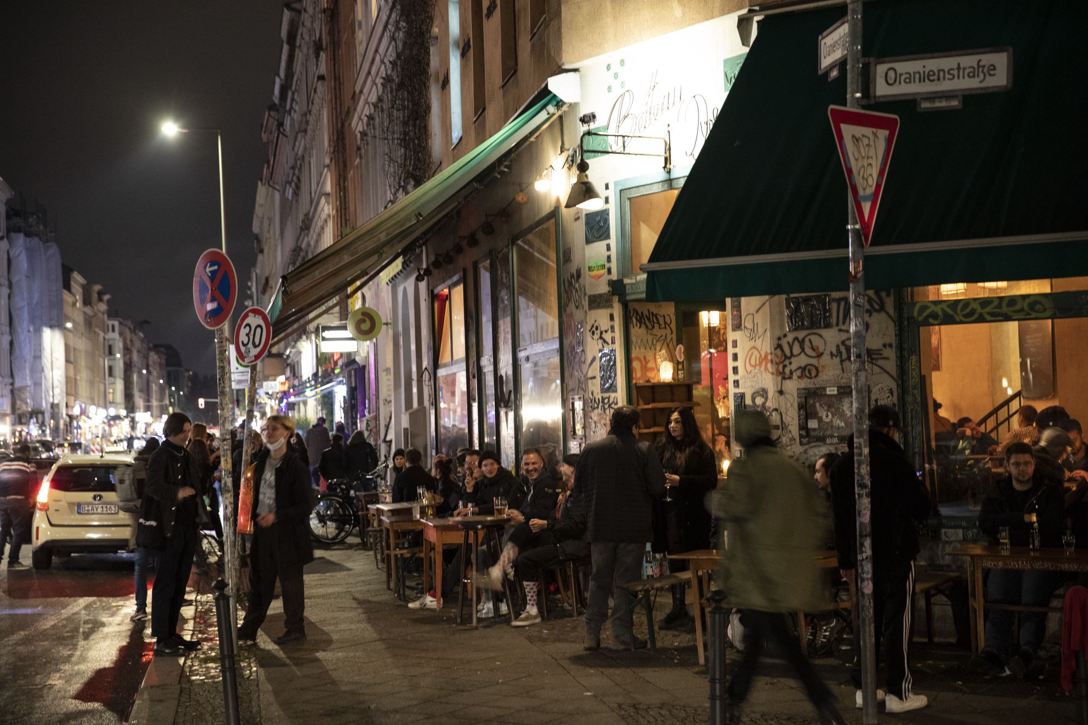 BERLIN, GERMANY - OCTOBER 16: People gather at bar in Kreuzberg district on October 16, 2020 in Berlin, Germany. About 11 bars and restaurants in city led a successful challenge to the recent 11pm curfew imposed by Berlin health authorities as a measure to slow the spread of the virus. The court rejected the argument, saying it saw no reason why the curfew would help against the virus, but it upheld a ban on the sale of alcohol after 11pm. (Photo by Maja Hitij/Getty Images)