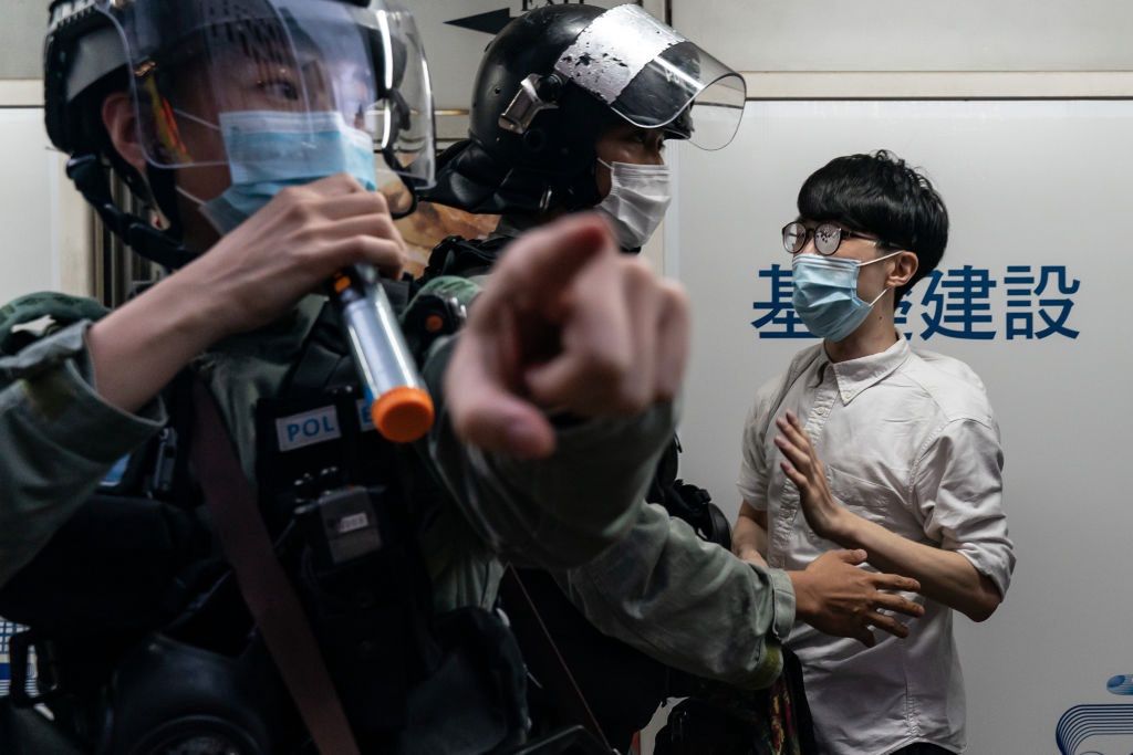 Hong Kong Marks One Year Since The Start Of Pro-Democracy ProtestsHONG KONG, CHINA - JUNE 09: Riot police detain a protester during a rally in Central district on June 9, 2020 in Hong Kong, China. The city marks one-year anniversary since pro-democracy protesters took the street to rally against the controversial extradition bill. (Photo by Anthony Kwan/Getty Images)Anthony Kwan