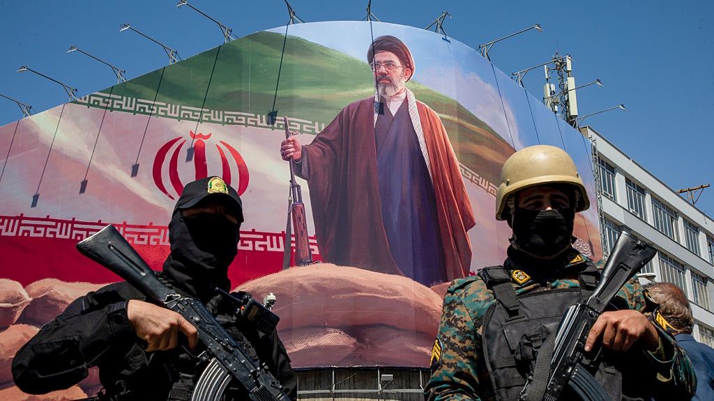 Iran And The US Agree Conditional Two-week Ceasefire
TEHRAN, IRAN - APRIL 9: Members of the Iranian security forces stand guard under a large portrait of Iran's new Supreme Leader, Mojtaba Khamenei, during a memorial to mark the 40th day since his father, Ali Ayatollah Khamenei, was killed in US-Israeli joint strikes, on April 9, 2026 in Tehran, Iran. On April 8 President Donald Trump announced a two-week ceasefire between the US and Iran, conditional on shipping being allowed to resume through the Strait of Hormuz. (Photo by Majid Saeedi/Getty Images)
Majid Saeedi