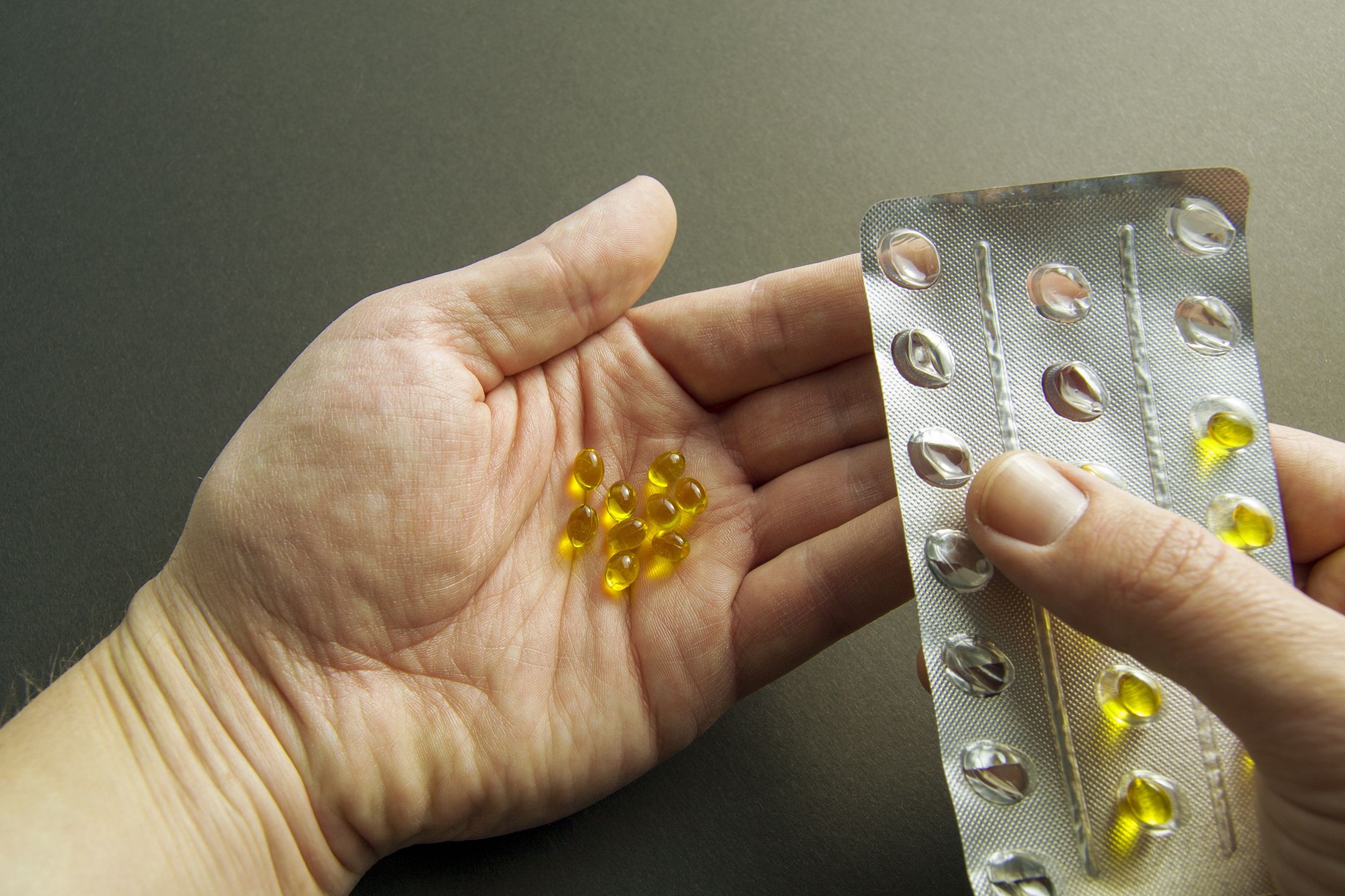 Squeezing pills into the hand. hand holds yellow pills. vitamin d in hand. treatment and prevention of diseases. Dietary supplement
Squeezing pills into the hand. hand holds yellow pills. vitamin d in hand. treatment and prevention of diseases. Dietary supplement
Maksim Omelyanchuk