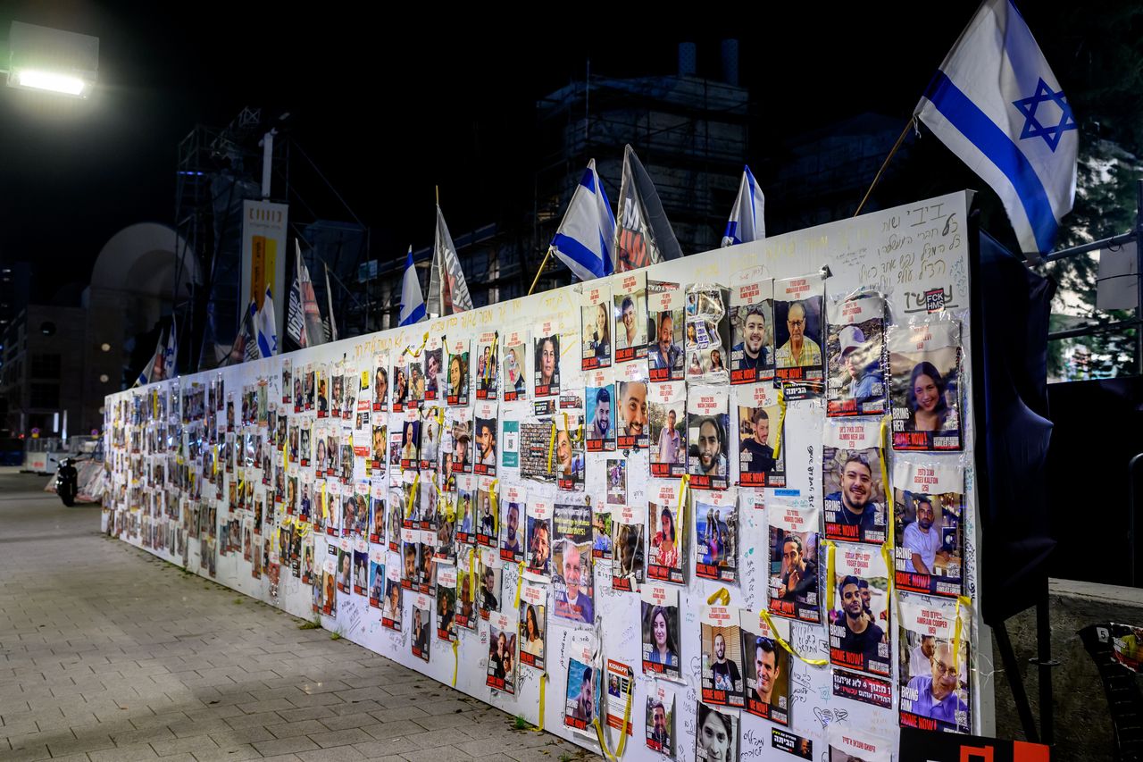 TEL AVIV, ISRAEL - FEBRUARY 20: Posters of the Hamas hostages are posted on a wall at "Hostages Square" outside the HaKirya base, which serves as IDF headquarters, where family members and supporters made an encampment to demand their return on February 20, 2024 in Tel Aviv, Israel. Hamas members on October 7 attacked Israeli towns around the Gaza Strip, killing more than 1200 people, including women and children, and kidnapping more than 200 others. One hundred and thirty hostages remain in captivity, according to published reports. (Photo by Roy Rochlin/Getty Images)