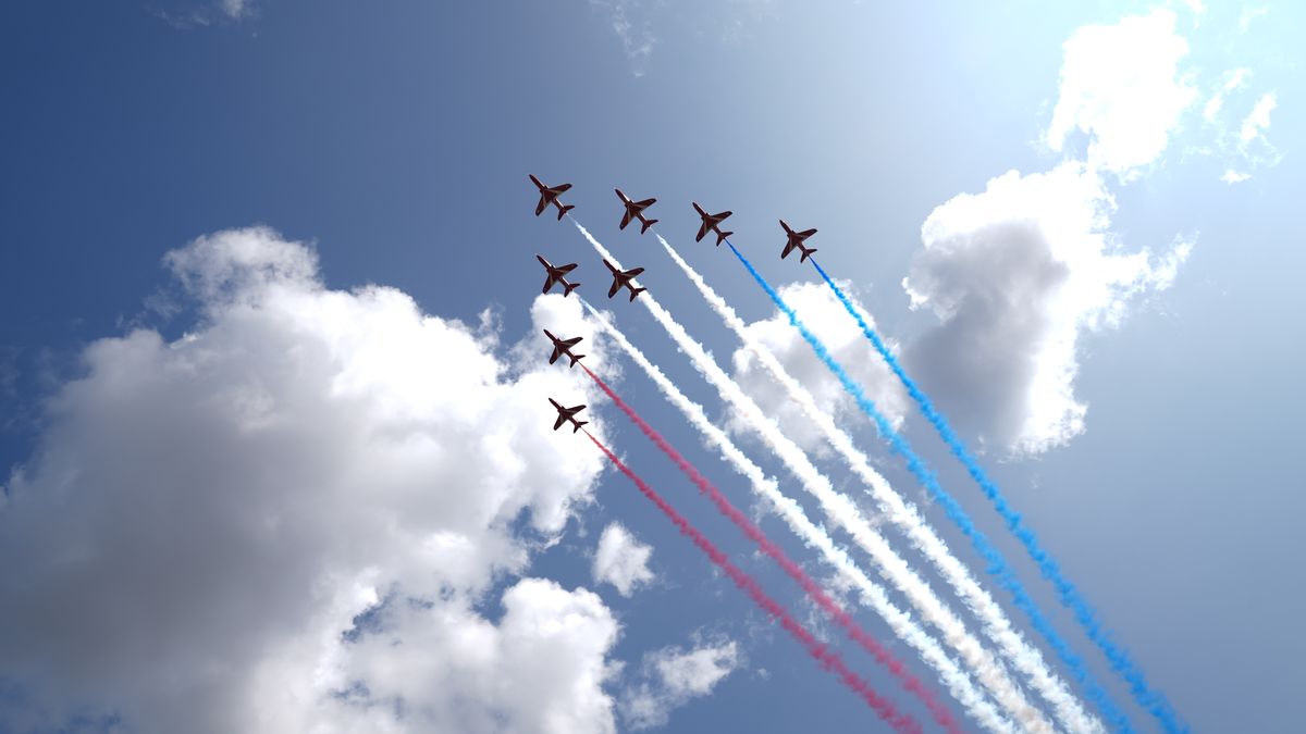 ALREWAS, STAFFORDSHIRE - AUGUST 15: The Red Arrows fly over the Service of Remembrance to commemorate the 80th Anniversary of VJ Day at The National Memorial Arboretum on August 15, 2025 in Alrewas, Staffordshire. The service commemorates the 80th Anniversary of Victory over Japan Day, or VJ Day, which marks the announcement of Japan's acceptance of the terms of the Potsdam Declaration on August 15, 1945, effectively bringing WWII to an end.  (Photo by Joe Giddens-WPA Pool/Getty Images)