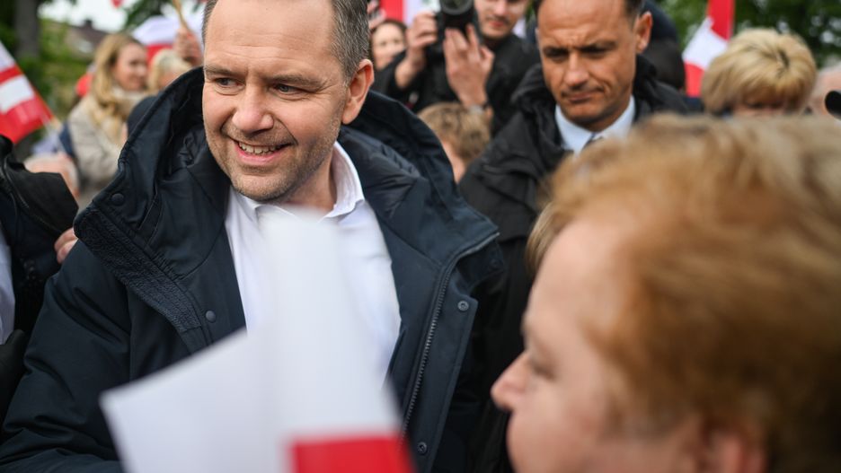 GARWOLIN, POLAND - MAY 05: Karol Nawrocki, a non-partisan Presidential candidate supported by the Law and Justice Party, greets supporters and gives autographs during a political rally as the Presidential campaign enters the last two weeks on May 05, 2025 in Garwolin, Poland. Karol Nawrocki's rally in Garwolin comes days after his meeting with US President Donald Trump in the White House, in a show of support for Nawrocki as the candidate for Poland's nationalist opposition party Law and Justice (PiS), ahead of the country's upcoming presidential election on May 18. Nawrocki has been polling closely behind the ruling Civic Coalition (KO)'s candidate Rafal Trzaskowski. If neither wins 50% of the vote in the first round ballot, a runoff will be held on June 1.  (Photo by Omar Marques/Getty Images)