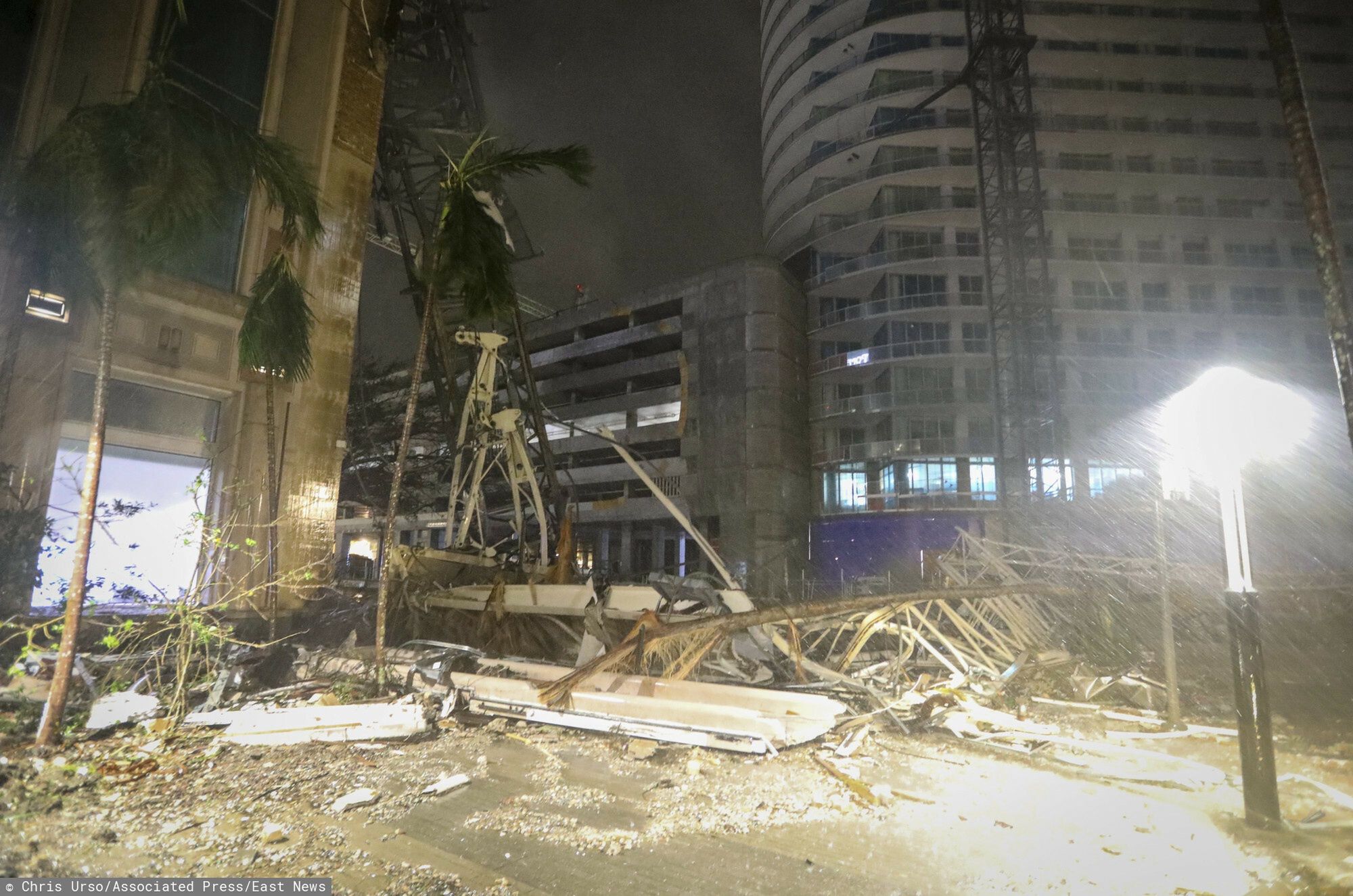 TemporaryDebris covers the ground near a crane that fell onto a building along 1st Avenue South in St. Petersburg, Fla., as Hurricane Milton's strong winds tore through the area Thursday, Oct. 10, 2024. (Chris Urso/Tampa Bay Times via AP)Chris Urso