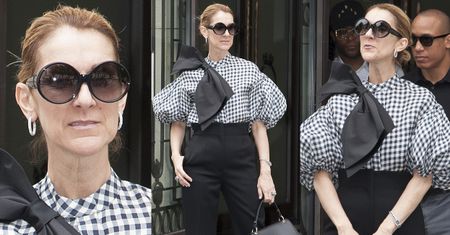 Wystylizowana Celine Dion pozuje przed hotelem